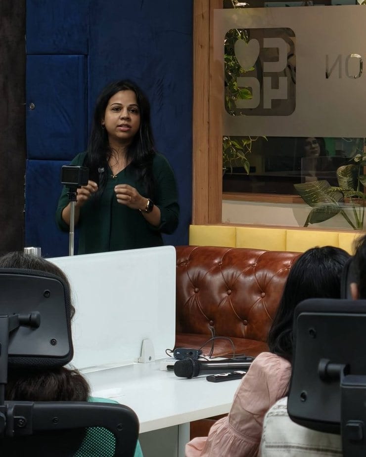 A speaker presenting to a small group at an AI Safety India session in Bengaluru.